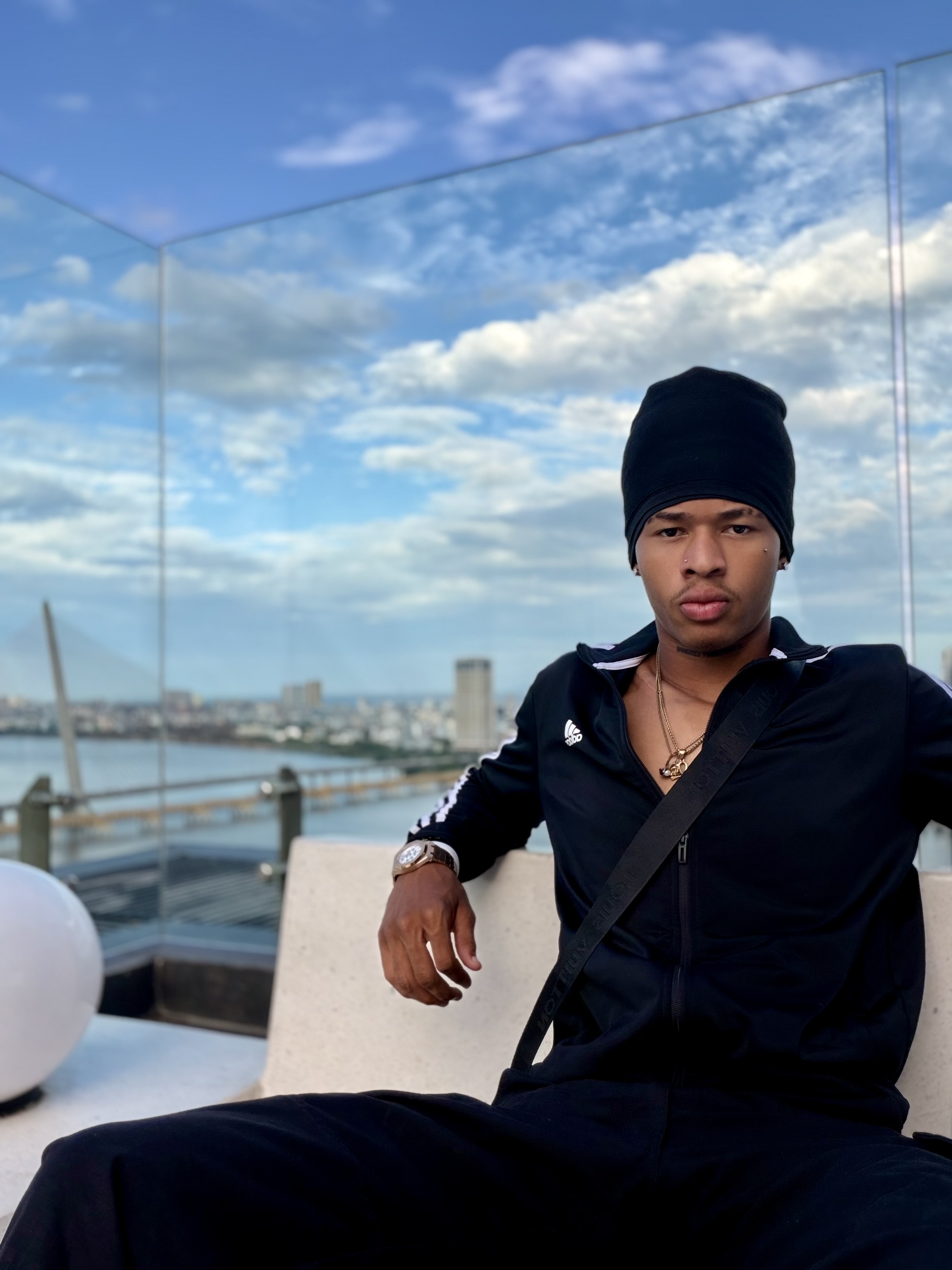 Azekiel on a rooftop overlooking the city