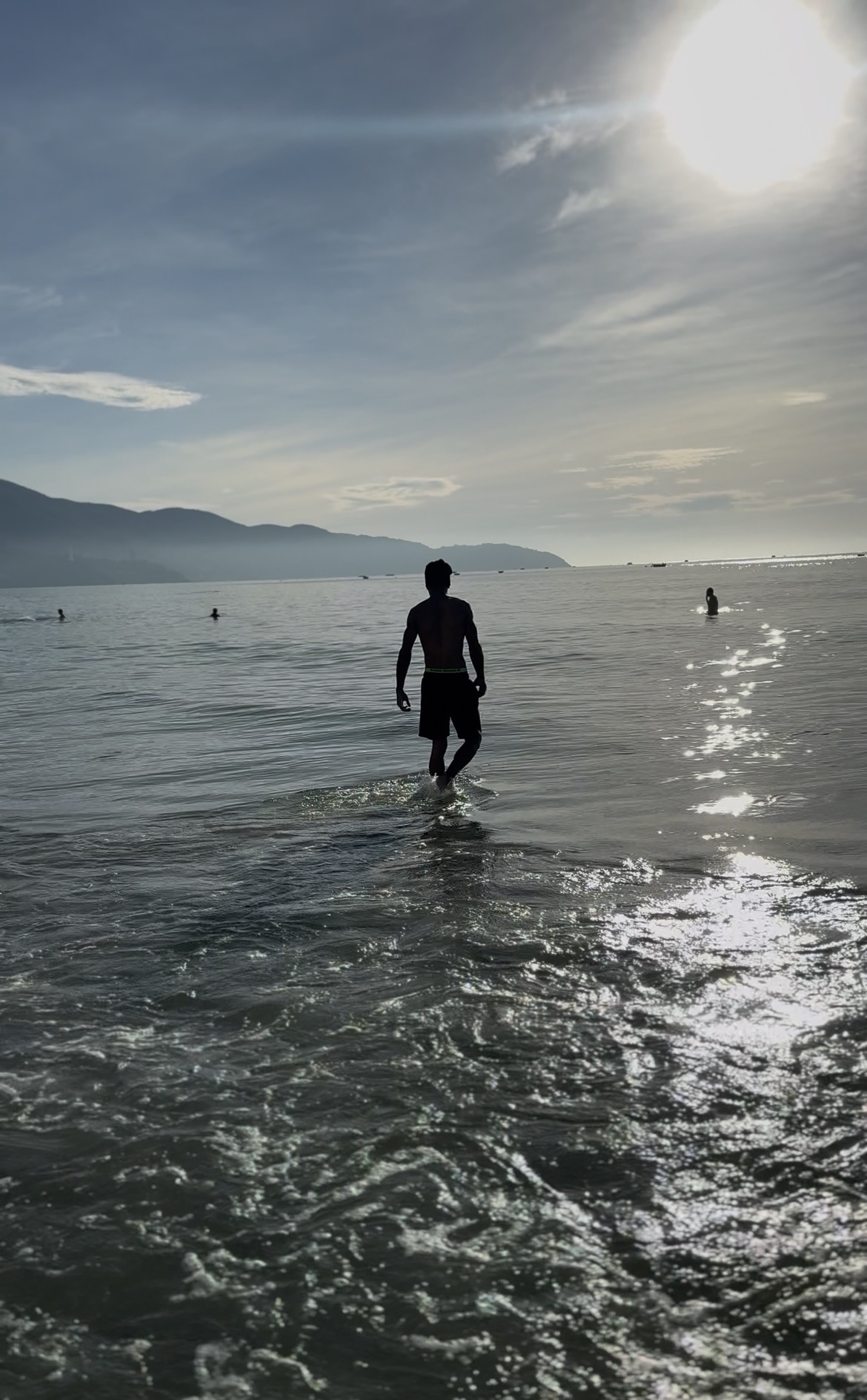 Azekiel walking through shallow water