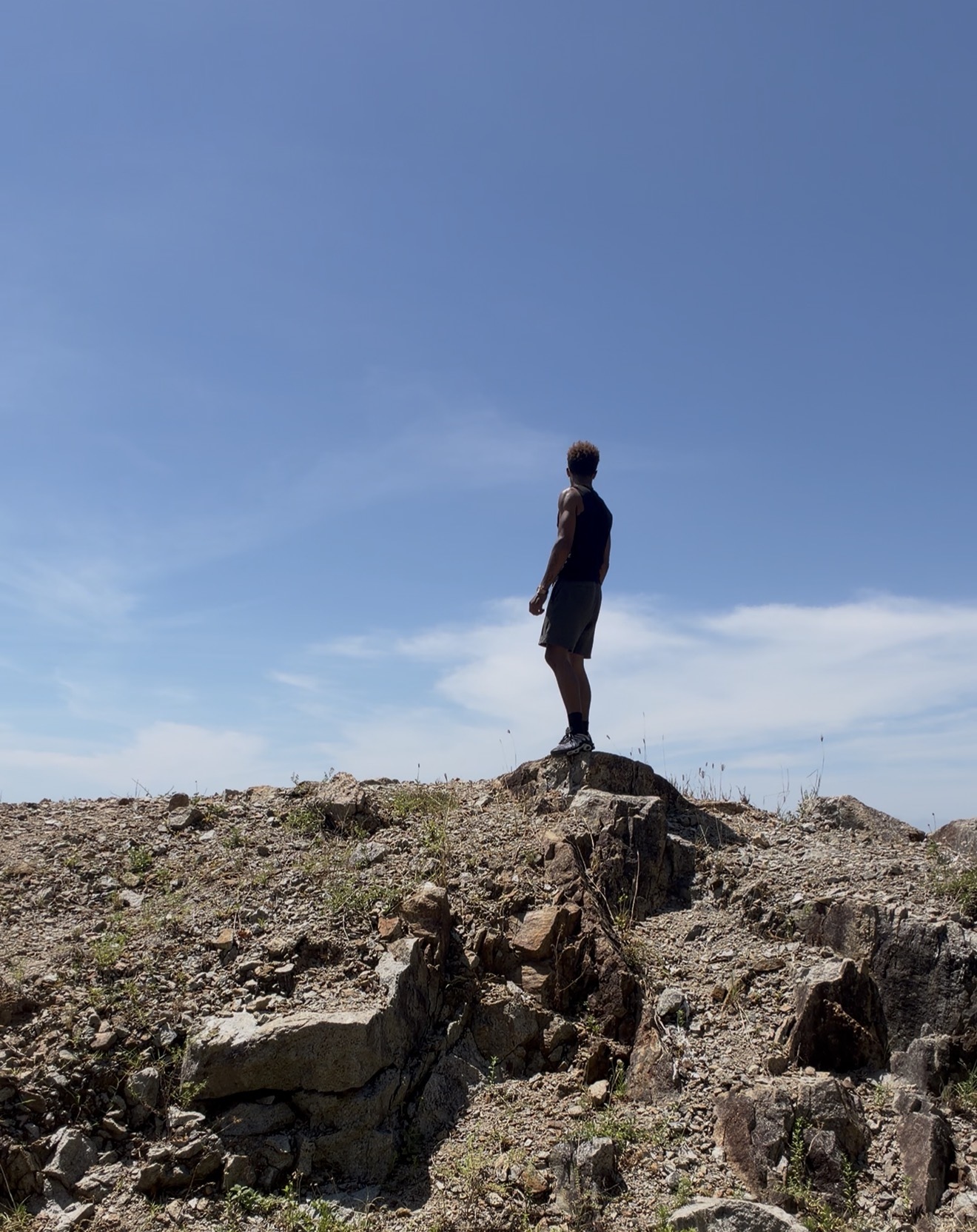 Azekiel standing on a mountain ridge